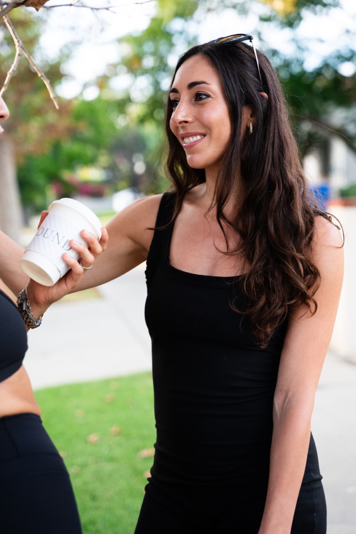 A smiling woman at an outdoor gathering
